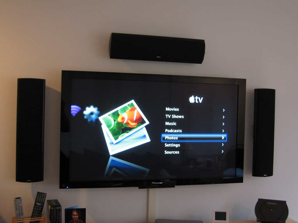 Apple TV main menu on a flat screen TV.