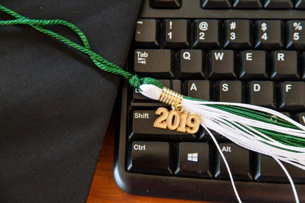 Keyboard with graduation hat tassle on it