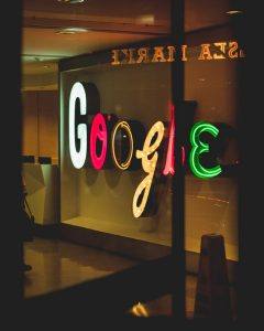 neon letter signs spelling out google hung on a wall