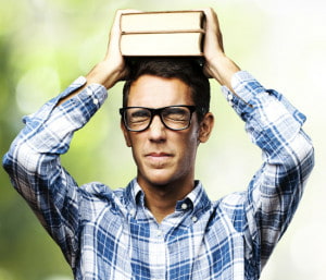 man with books on head