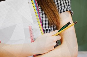 Higher education student with notebook