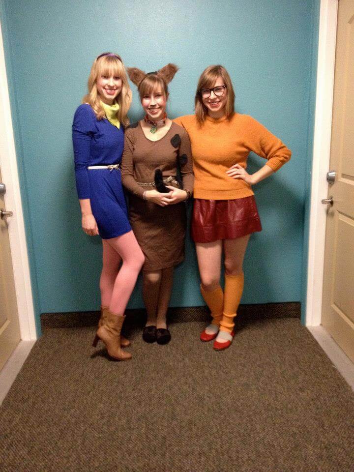 three women wearing scooby doo costumes