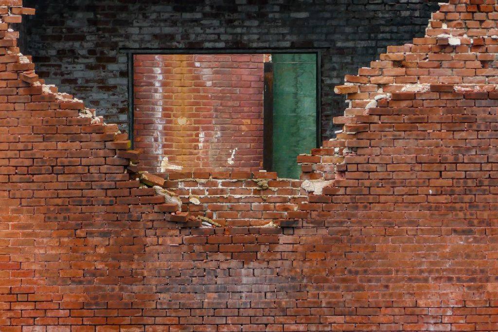 brick wall partially broken
