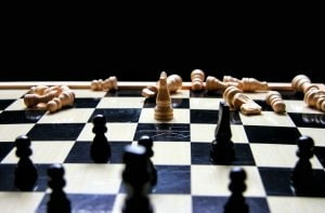 Chess board with fallen pieces.