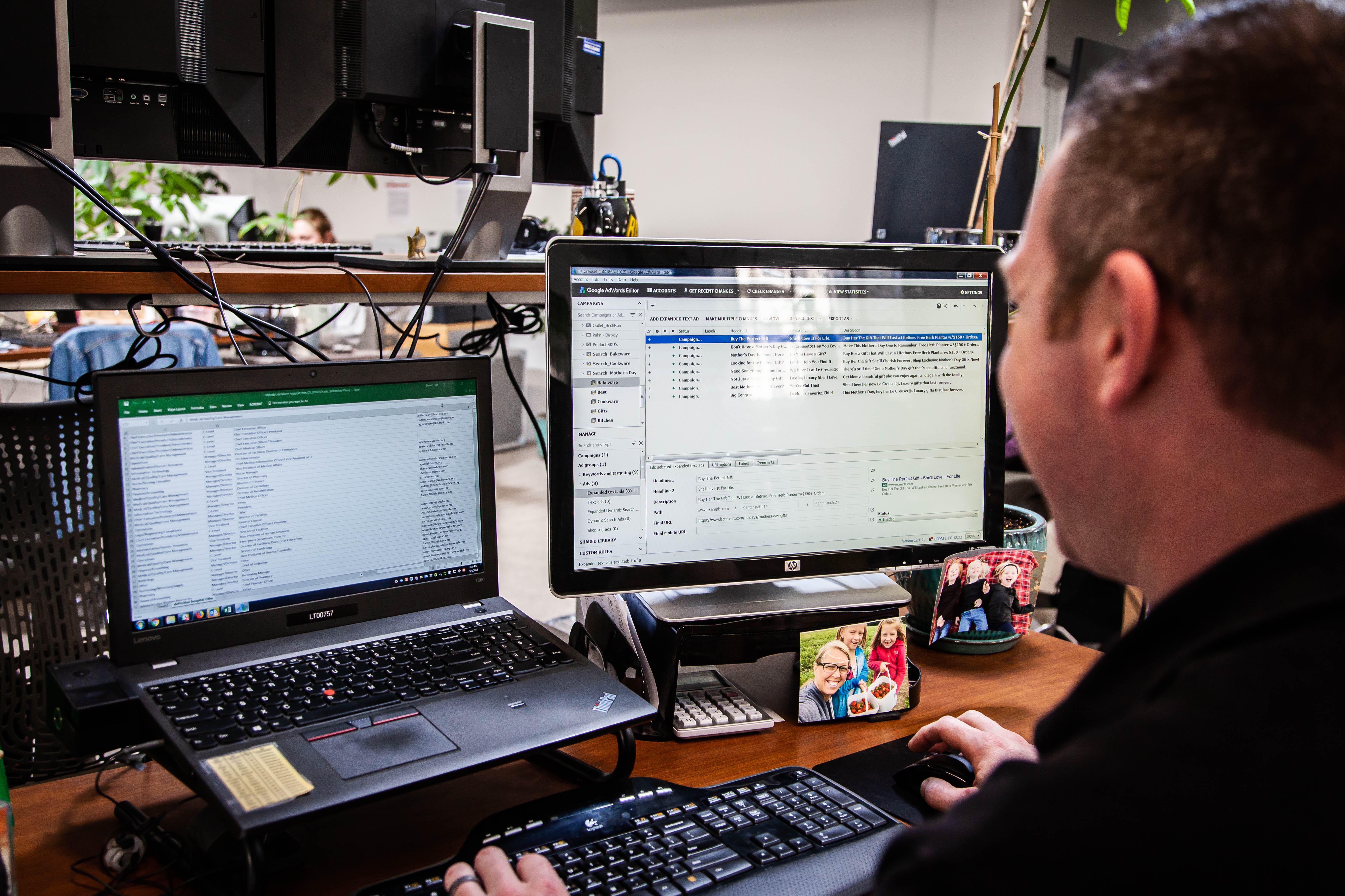 Oneupweb's Director of Paid Media working on his computer.