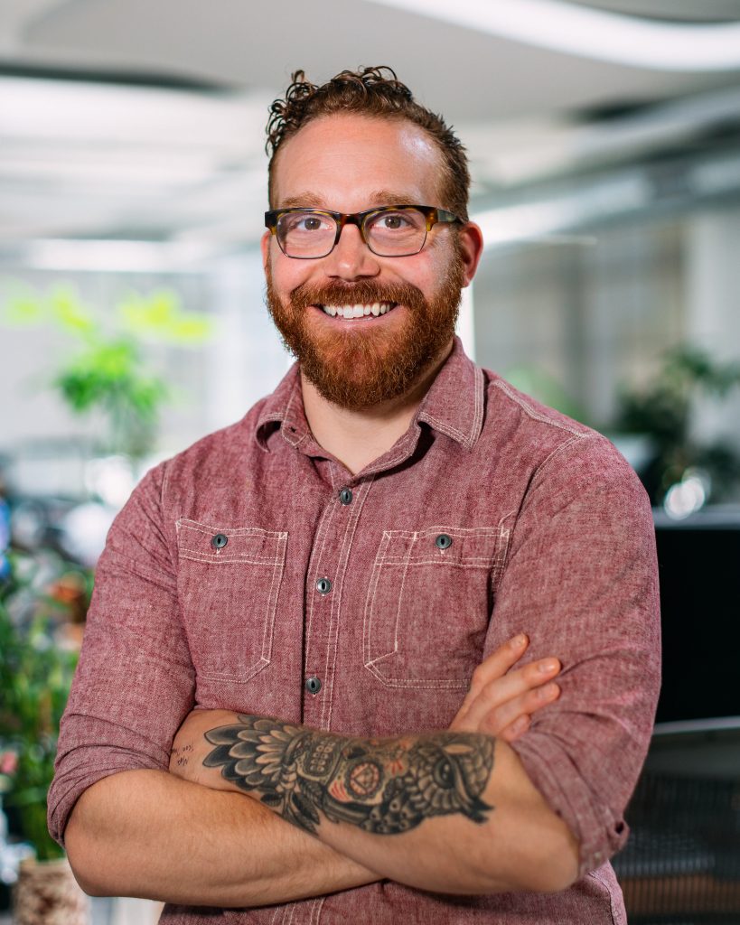A professional headshot of a male Oneupweb marketing employee Nate Totten.