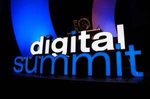 Digital Summit sign on a stage.