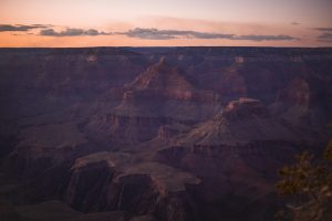 red rocky canyon spreading into the distance at dusk