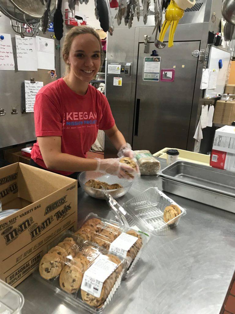 emily tewers serves food at st francis high school