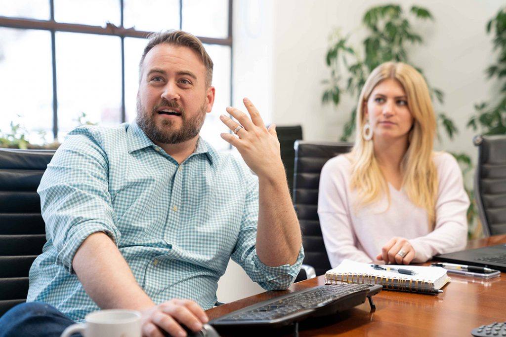 man and woman in a meeting