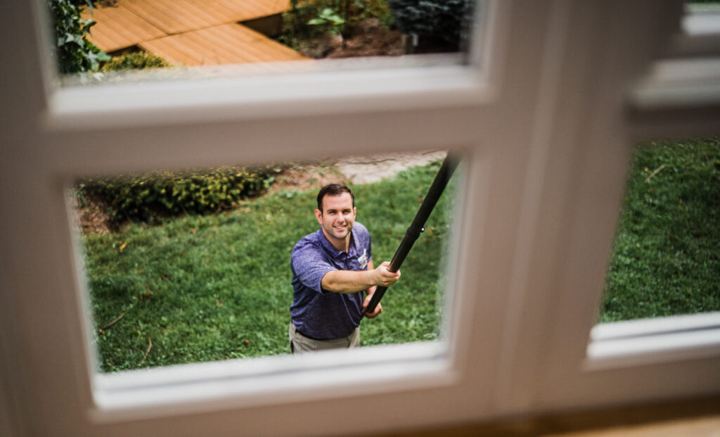 a window washer looks up while working