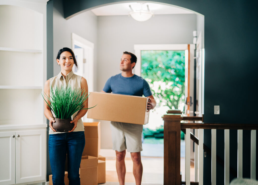 a woman and man move into a new home