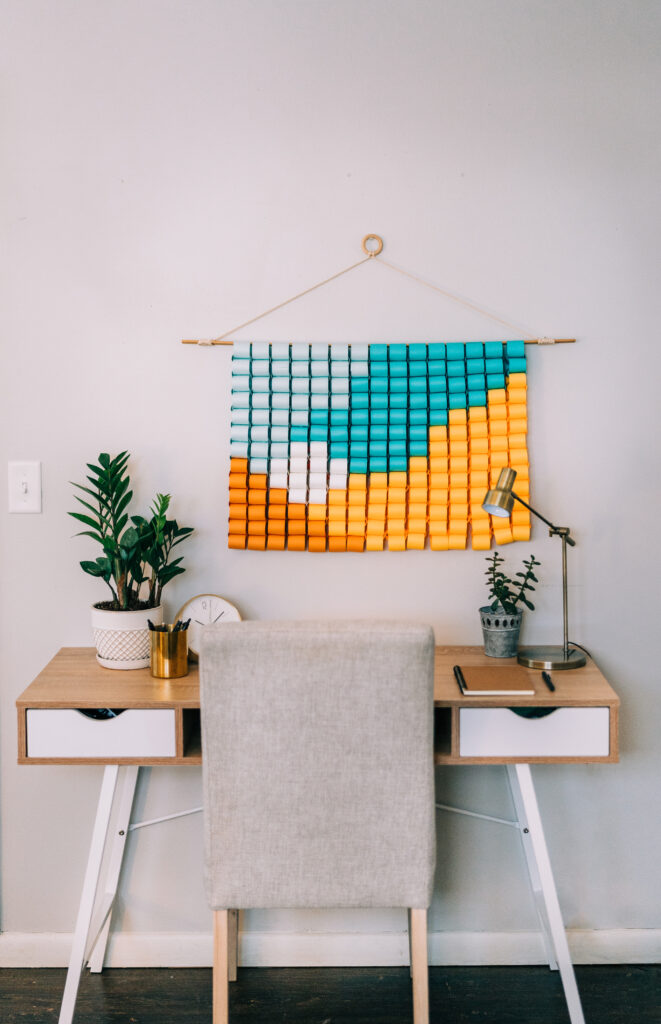 A desk with a paper decoration above it