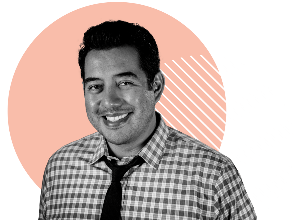 Oneupweb CEO Fernando Meza wears a tie and smiles