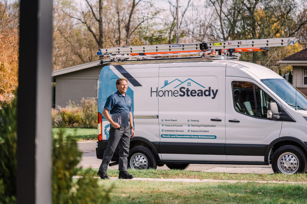homesteady employee walking by the work van for brand photography produced by oneupweb