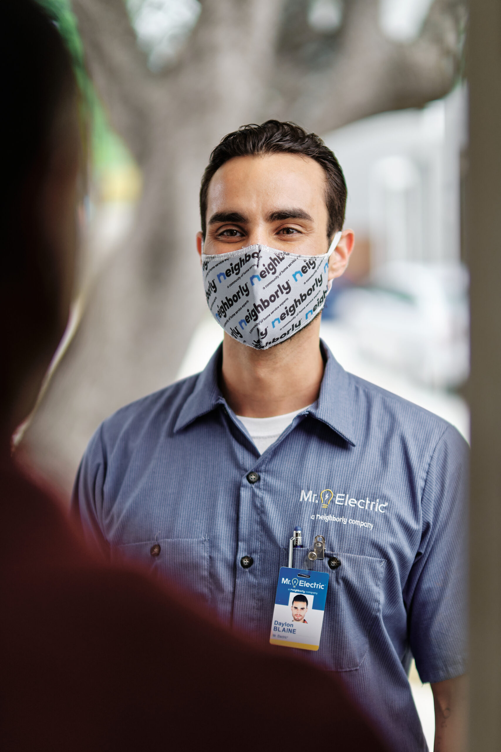 a home service worker greets a customer