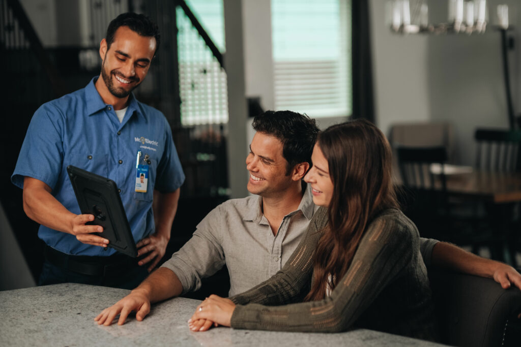 a home service worker talks to two customers