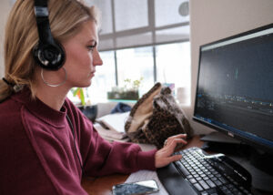 a woman edits video on her computer