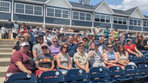 the oneupweb team at a baseball game